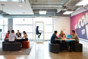 founders sitting at desk pods working in the DMZ