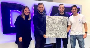 Members of the LAPSE team gifting the NFT to the DMZ
