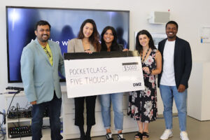 PocketClass smiles upon receiving a $5000 cheque