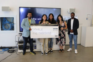 DMZ Basecamp 2023 participants, Capable, pose with their $5000 cheque